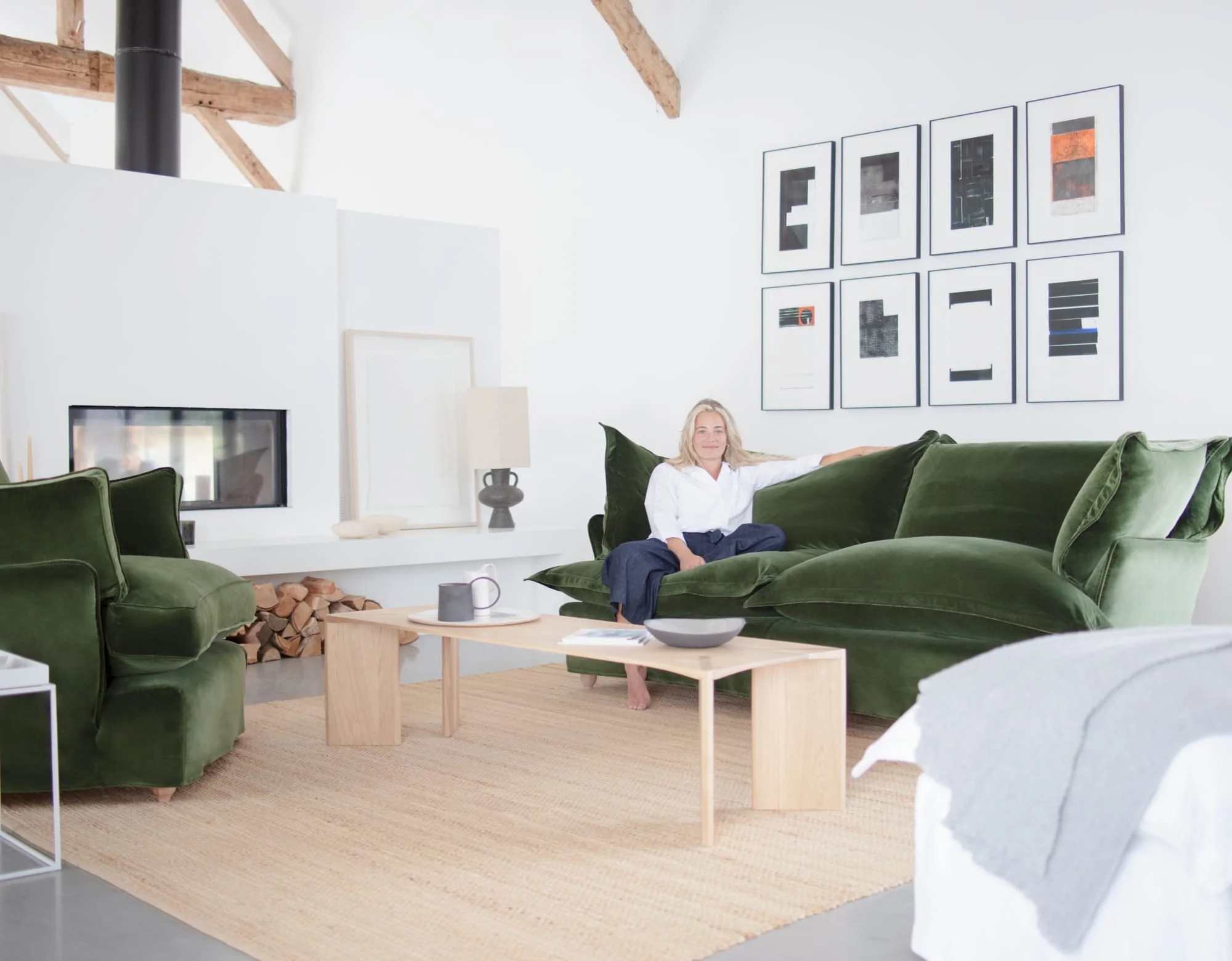 Marnie in a modern room setting featuring Tarragon green velvet Song sofa and Otter box edge Loveseat